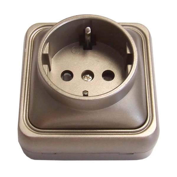 Enchufe T.T. superficie bronce