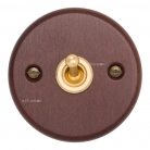 Interruptor madera oscura y latón