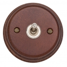 Interruptor madera oscura y níquel