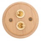 Interruptores madera clara y latón