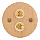 Interruptores madera clara y latón