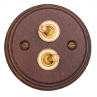 Interruptores madera oscura y latón